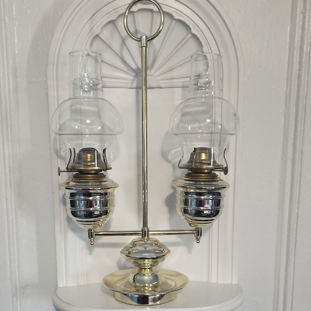 This is a vintage brass double oil lamp